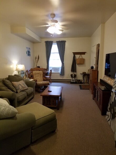 Living/dining room with furniture - 318 East Patrick Street