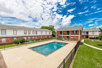 Building Photo - Centrally located freshly painted condo is...