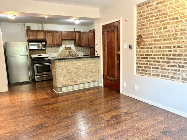 Building Photo - Condo with free heat! In-unit laundry, har...