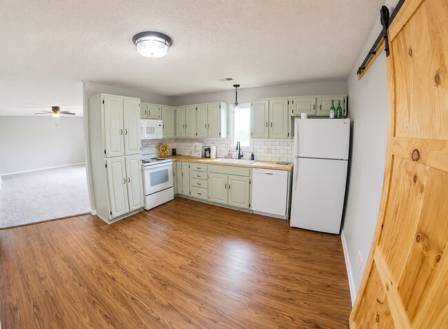 Building Photo - Pet Friendly + Washer & Dryer Included + Attached Garage! - Available June 19th!