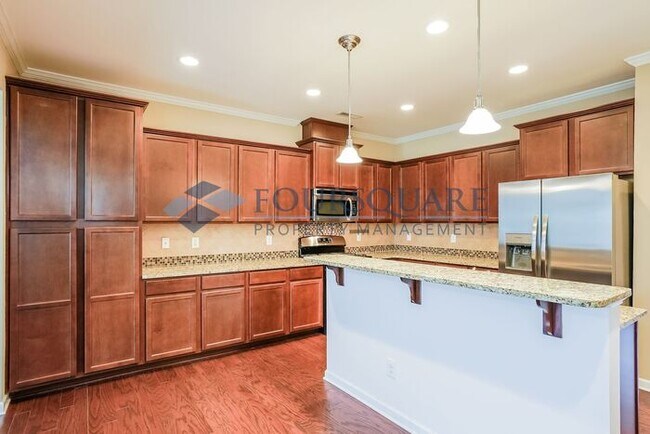 Building Photo - End Unit Townhome | Back Patio With Privac...