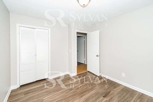 Building Photo - Welcome to this charming abode.