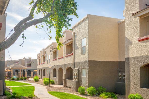Lush Green Courtyard Wit Walking Paths - Ranchwood Apartments