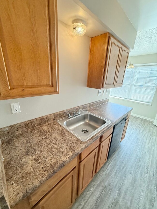 Building Photo - *** RENT READY!! Newly remodeled townhome! ALL Laminate.