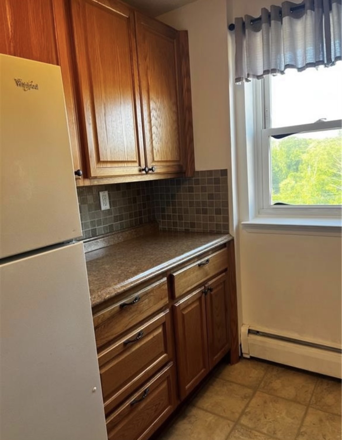 Kitchen countertop and Fridge - 70 Farmington Ave