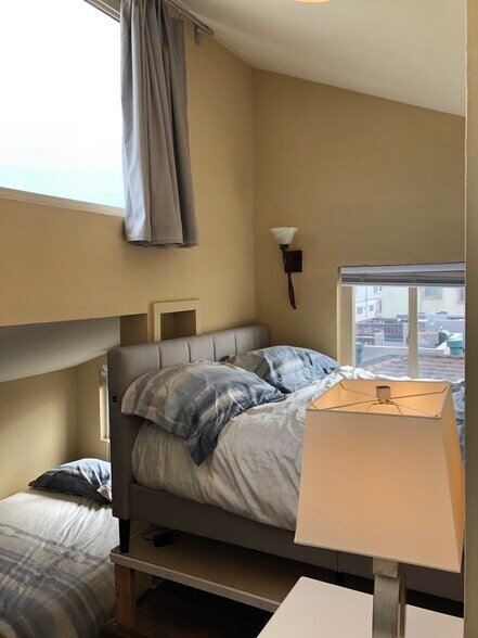 Crows' nest bedroom - first of two full beds. This one is elevated so you can wake up to ocean view - 3261 Ocean Front Walk