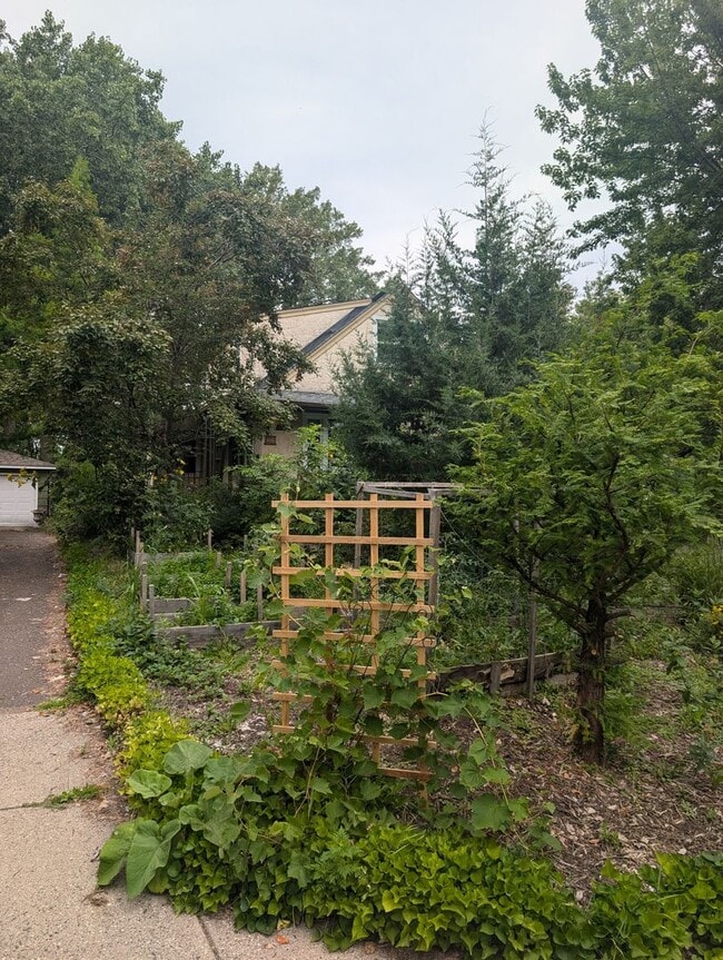 Building Photo - Charming Garden Oasis in West St. Paul – Fire Pit, Pond & Prime Location!