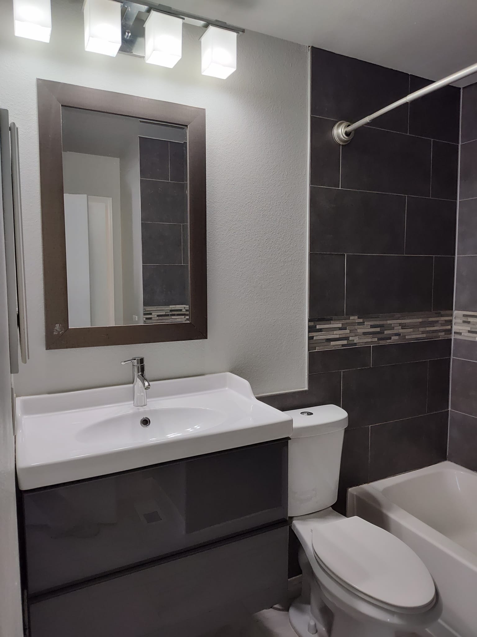 Bathroom with tub shower - 1811 S Quebec Way
