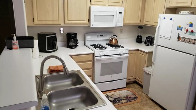 kitchen with all cookware, silverware, glassware - 5710 E Tropicana Ave