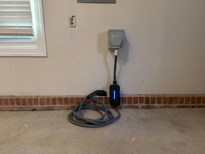 240 Level 2 EV outlet will support your charger you bring. - 115 Waterfall Ct