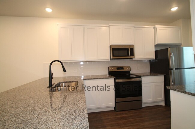 Building Photo - Upscale Four-Bedroom Townhome!