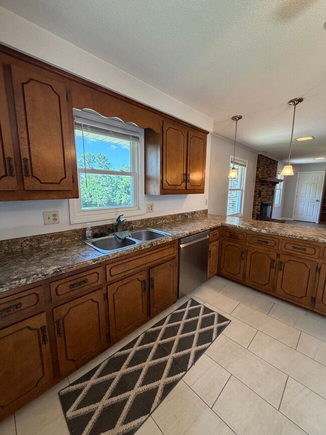Building Photo - Situated in the heart of Sango, massive lot, and includes a fully finished & recently remodeled b...