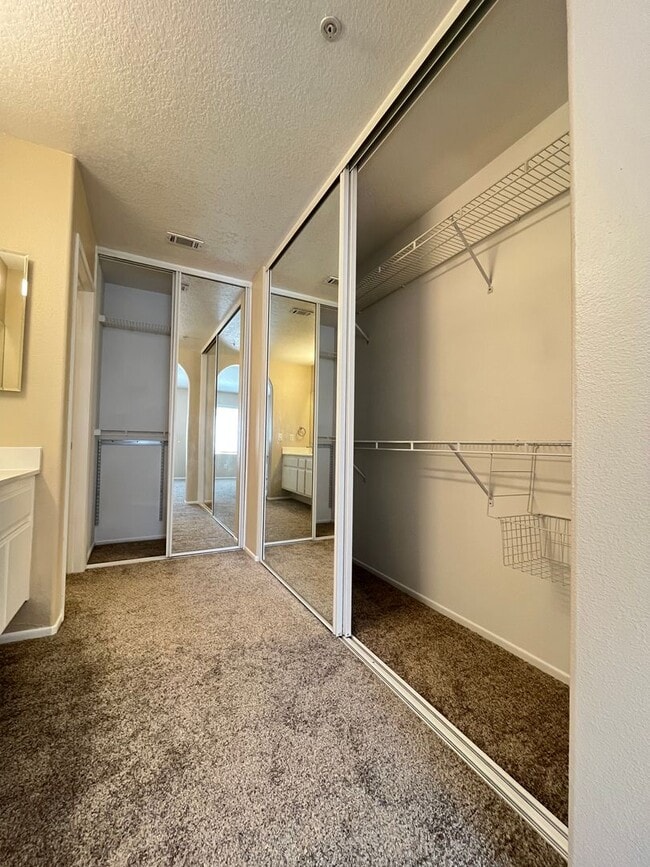 Building Photo - PICTURE PERFECT!  3 BR/3 BA END UNIT CONDO with DIRECT ACCESS 2 CAR GARAGE