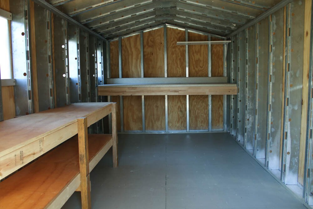 Workbench and storage shelves inside the shed - 2406 Boswell Rd