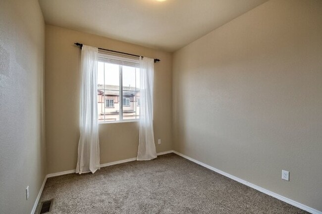 Building Photo - Immaculate 3-Bedroom Townhome with Stainless Steel Appliances and Attached Garage Near Peterson SFB