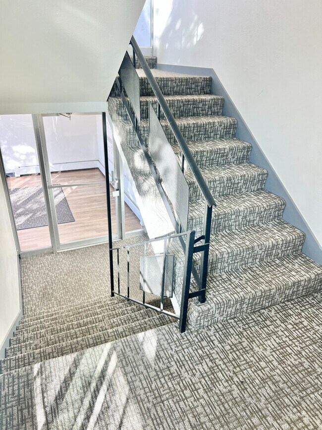 Experience modern elegance with this stylishly designed staircase, perfect for any contemporary home. - The Sloan