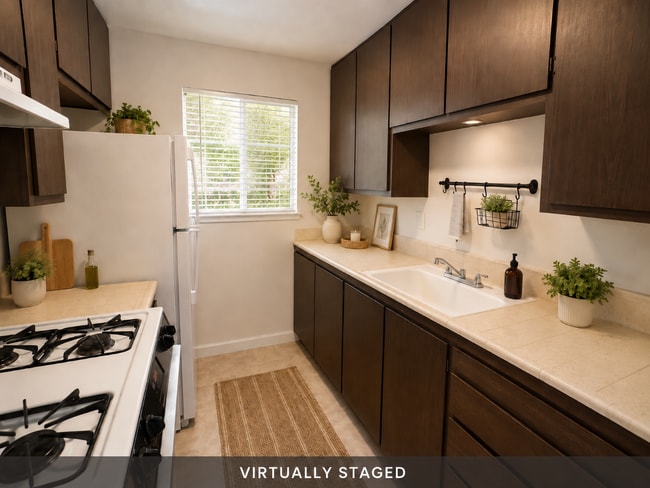 Building Photo - Updated 2 bedroom 1 bath condo in a quiet park like setting with a community pool