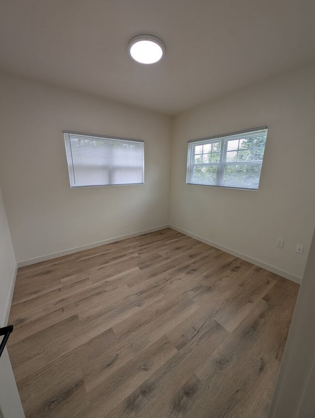 Building Photo - Adorable Four Bedroom w/ Fenced Yard Avail...