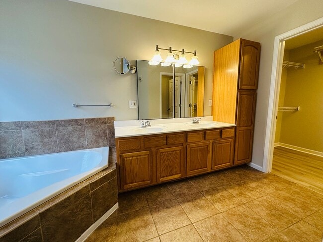 Building Photo - 2 bed, 2.5 bath updated townhouse w/ 1-car garage & Trex deck available now