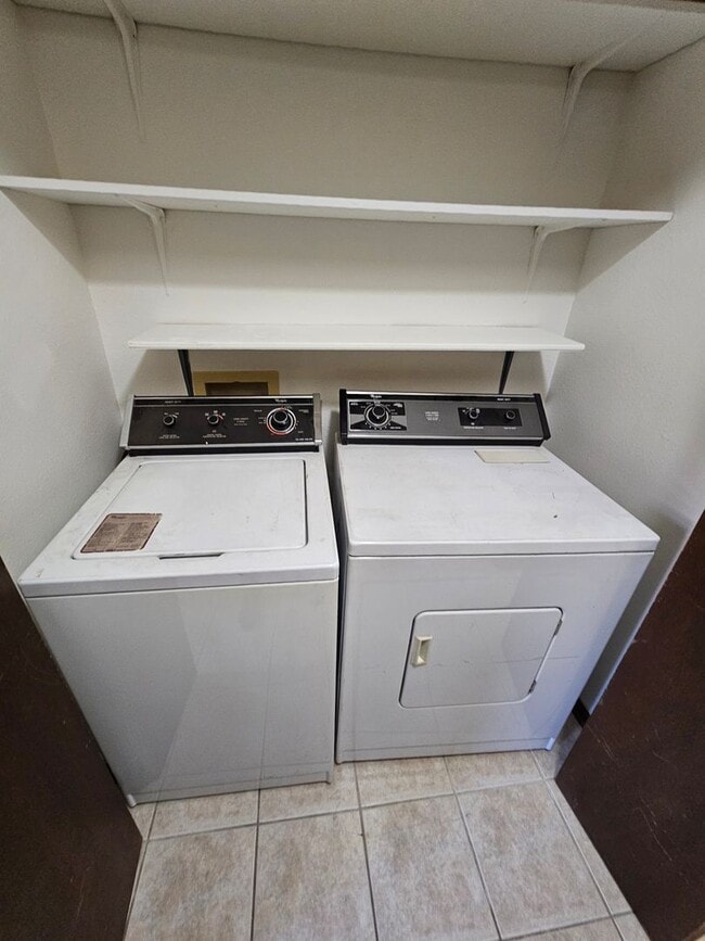 Building Photo - End Unit Condo with Private Patio