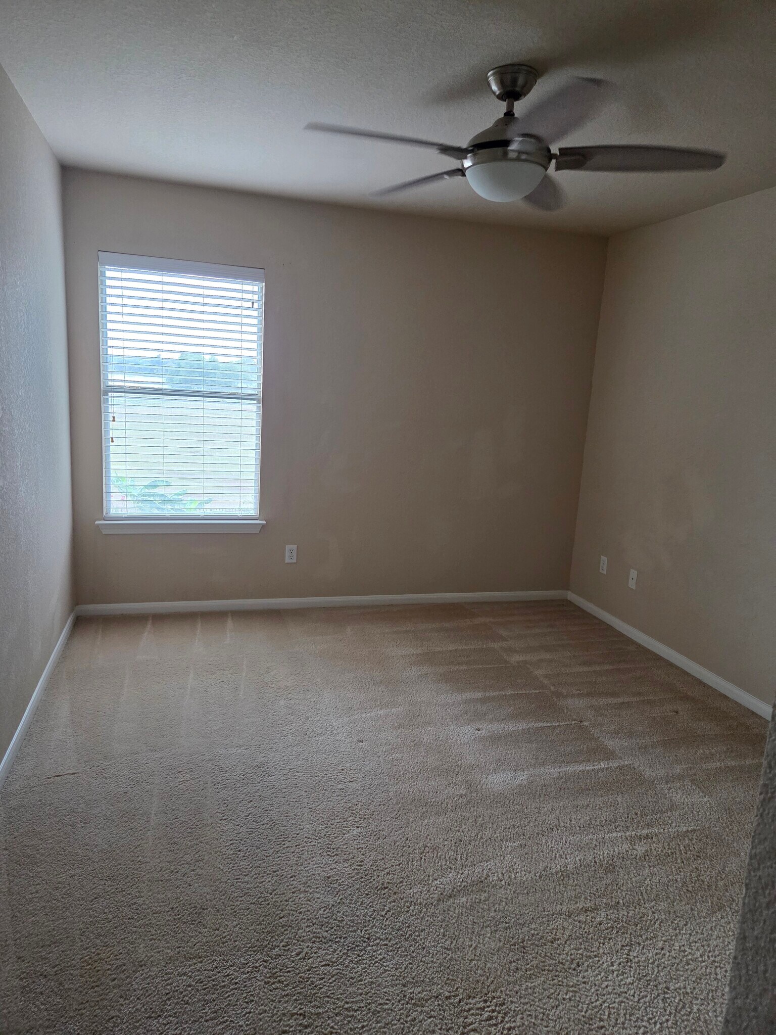 three bedrooms similar to this. Two with windows facing lake. One with window facing front. - 18204 Kermit Ct