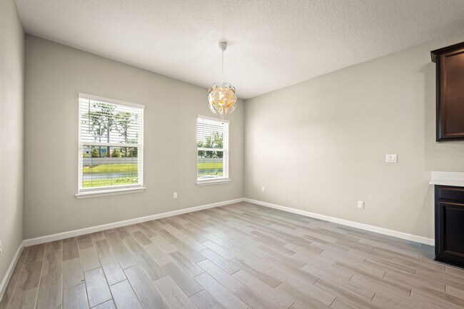 Building Photo - Spacious 4-Bedroom Home with Screened Pati...