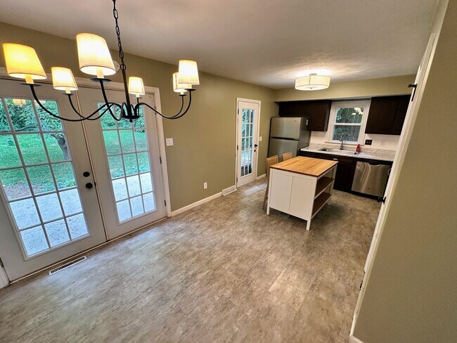 Building Photo - AVAILABLE NOW! Spacious 4 BR, 2 Bath House! Wood Floors, Attached Garage, W/D Included