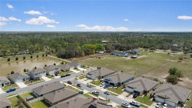 Building Photo - Move-In Ready 2BR/2BA Villa with Den + 2-Car Garage | Lake Nona Adjacent | Suncrest at St. Cloud