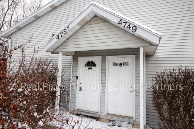 Building Photo - 2-Bed, 1-Bath Upper Unit with Garage & Porch – Steps from Paul Henry Trail