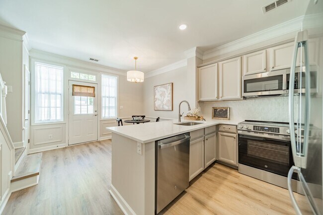 Building Photo - UPGRADES! Two Bedroom Townhouse - Six Mont...