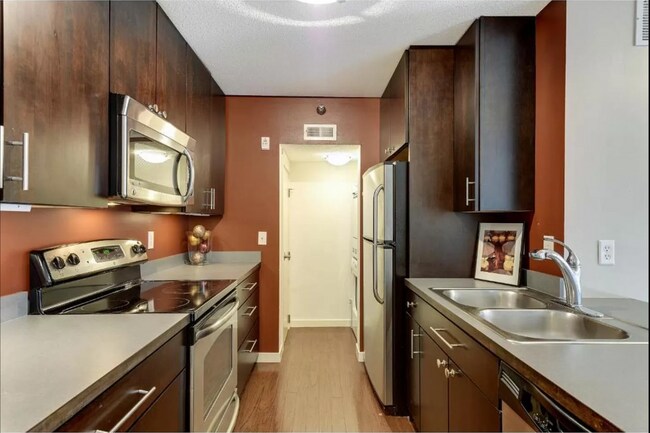 Building Photo - 1Bd/1Ba with Heated Parking, Stainless Steel Appliances, and Pool Access