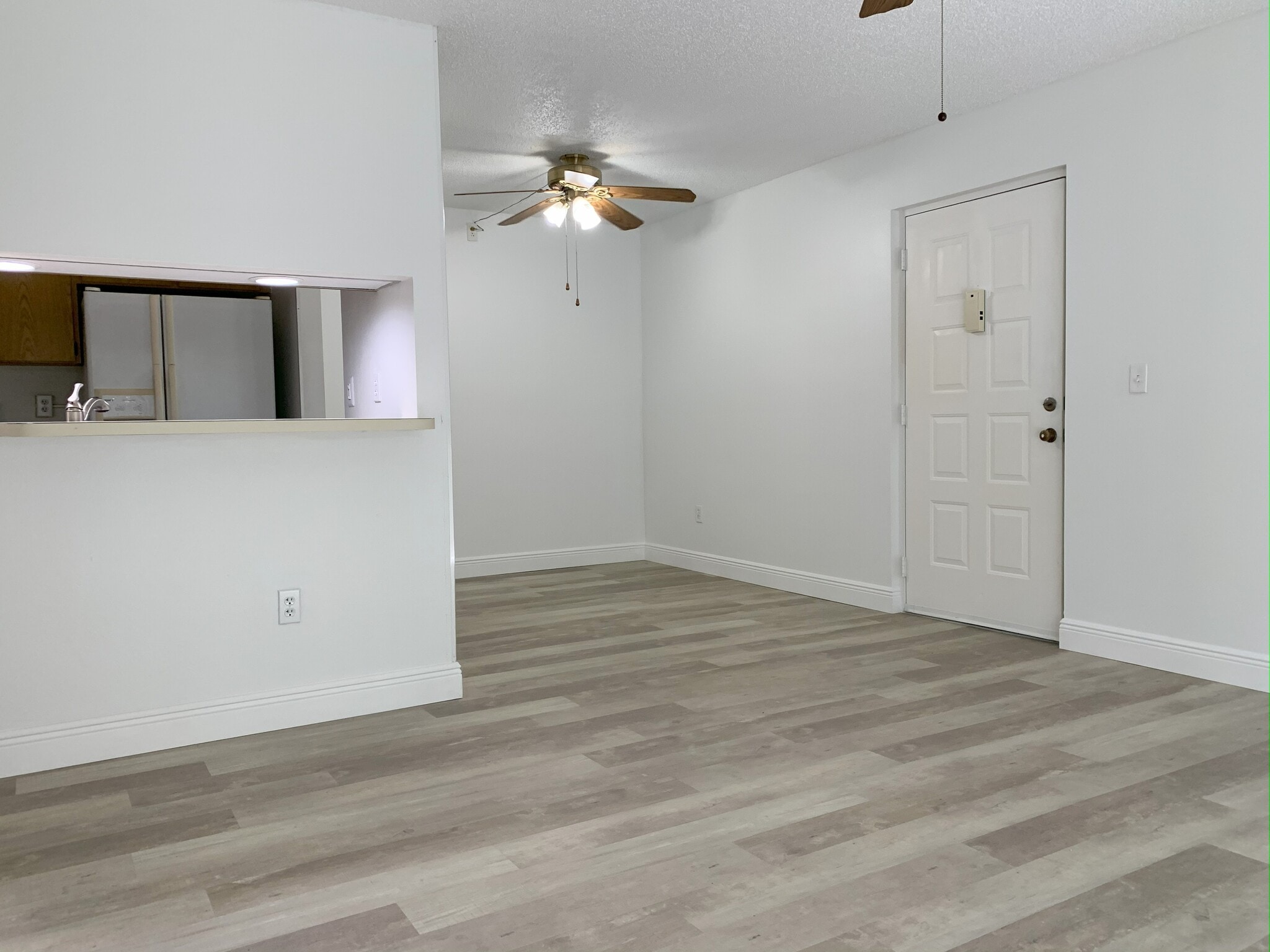 Luxury vinyl flooring in dining, kitchen and living room - 9570 Green Cypress Ln