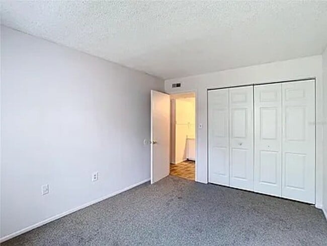 Building Photo - 2BR Condo Near UCF – All-Inclusive Living & Resort Amenities!