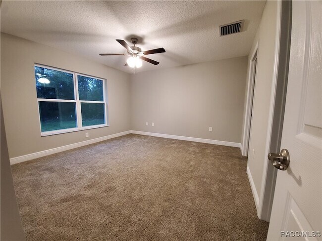 Building Photo - 8687 N Paradisea Dr