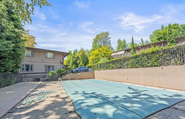 Building Photo - Spacious 2-Bedroom Condo with Forest Views, Private Balcony, In-Unit Laundry & Community Amenitie...