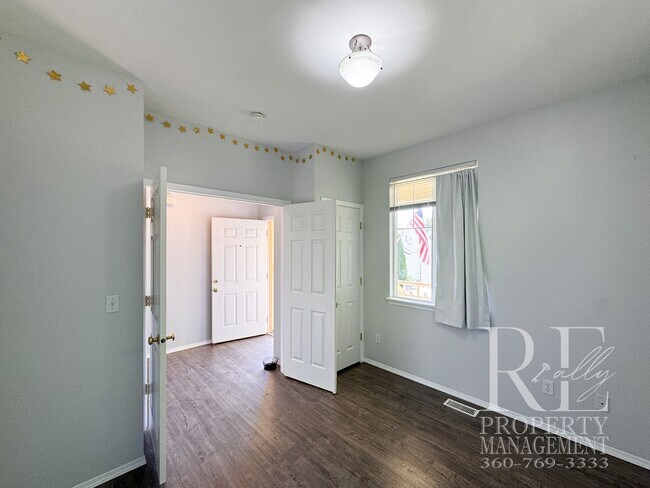 Building Photo - Dual Primary Suites, Huge Backyard Deck & Sun-Filled Living Spaces Near Everyday Conveniences