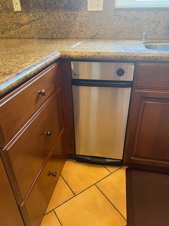 Trash Compactor - 6947 Jellico Ave