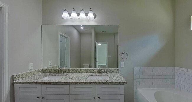 Building Photo - Spacious, Stylish, and Simply Perfect — 4 Bedroom Home