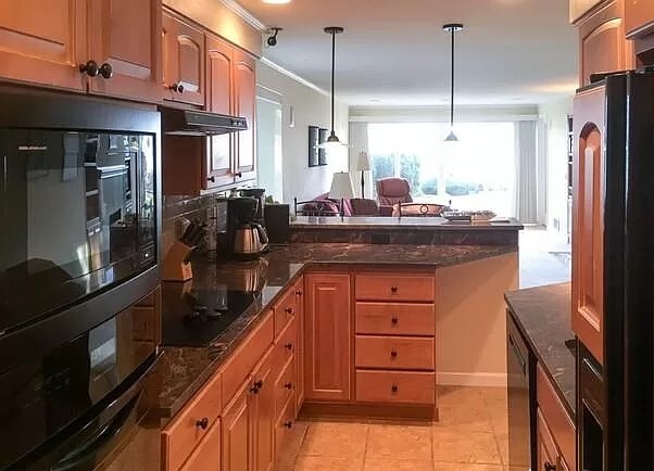 Pendant lights over kitchen bar area (looks to Lake) - 6620 Lake Washington Blvd NE