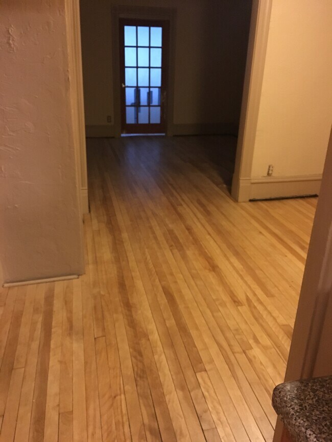 From the kitchen you can see the dining room, living room, and into the sunroom - 3452 Nicollet Ave