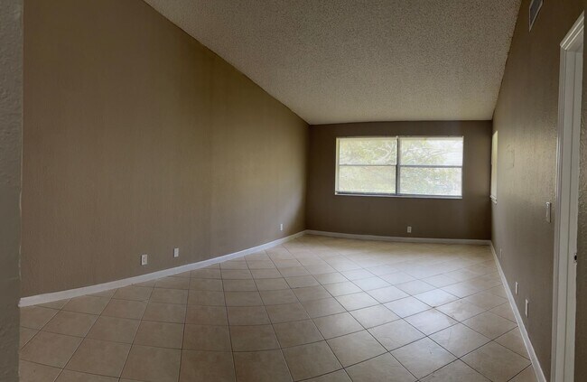Building Photo - AFFORDABLE 2/2 IN CORAL SPRINGS! Great Location + Amazing Specials!