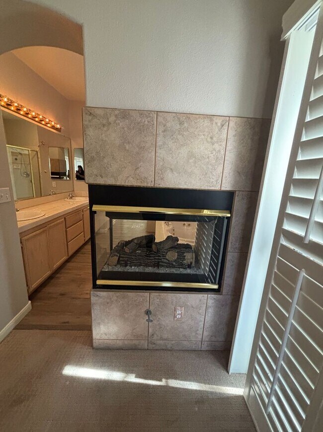 Building Photo - Gated Green Valley Ranch Townhome | 2 Bed | 2.5 Bath | 2-Car Garage