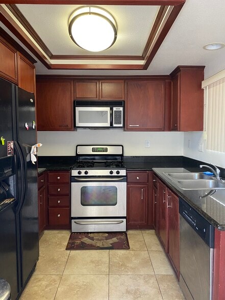 Kitchen - Plenty of Cabinet space and Appliances included - 408 N Imperial Ave