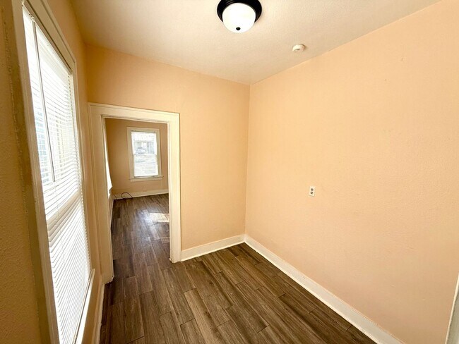 Building Photo - *COMING SOON* Charming 1-Bedroom Duplex With Laminate Flooring Throughout + Fenced Backyard