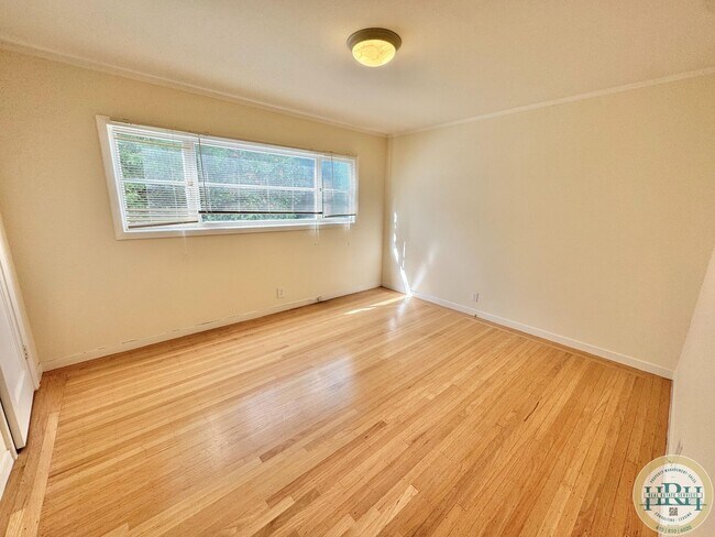 Building Photo - Spacious & Bright 2BR|1BA w/ One Garage Parking Spot Included