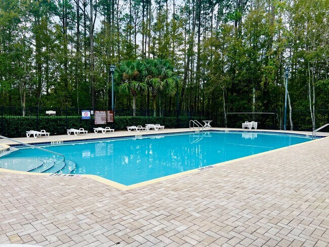Building Photo - Gated Comfort Condo, Poolside Vibes: Your Next Home Awaits at Merrill Pines