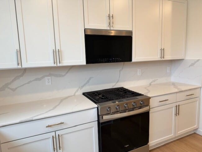 Building Photo - Elegant 4-Bed, 4-Bath 3-Story Home with Gourmet Kitchen & Private Backyard