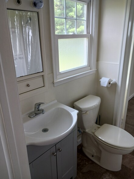 Newly remodeled bathroom with tub & shower & new flooring - 32 Duquesne Ave