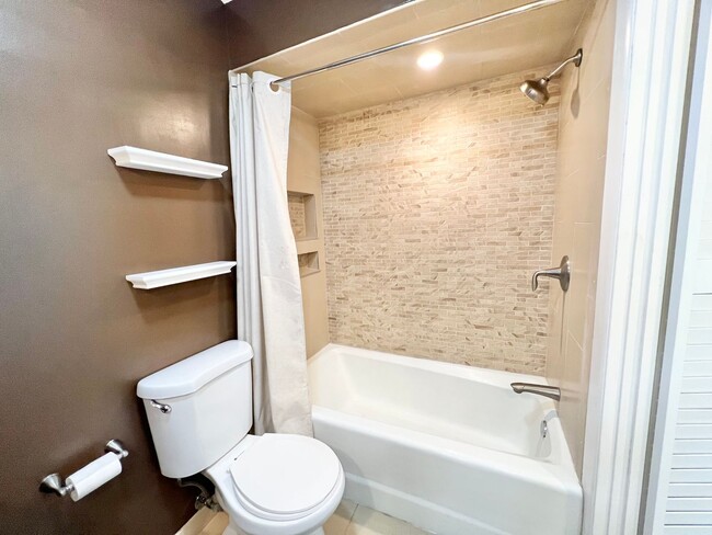 Building Photo - Contemporary 2 Bed Condo with 2 Garage Parking Spaces, Community Pool, and 3 Private Balconies