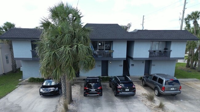 Building Photo - MOVE IN SPECIAL $500 OFF FIRST MONTH!! Beach Living at it's Best!  Two Bedroom/One Bath Ground Fl...